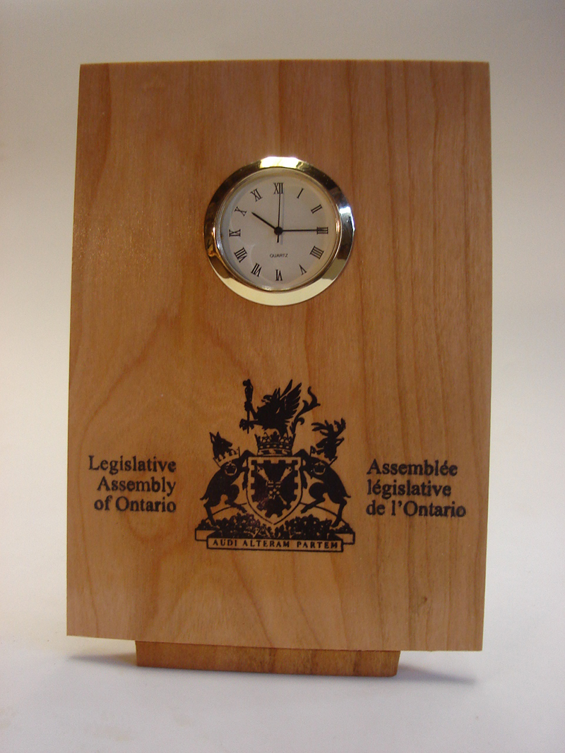 Flat Tilted Clock with logo imprint - 4"w x 6"h x 2" d - 1 3/8" diameter quartz mechanism.
